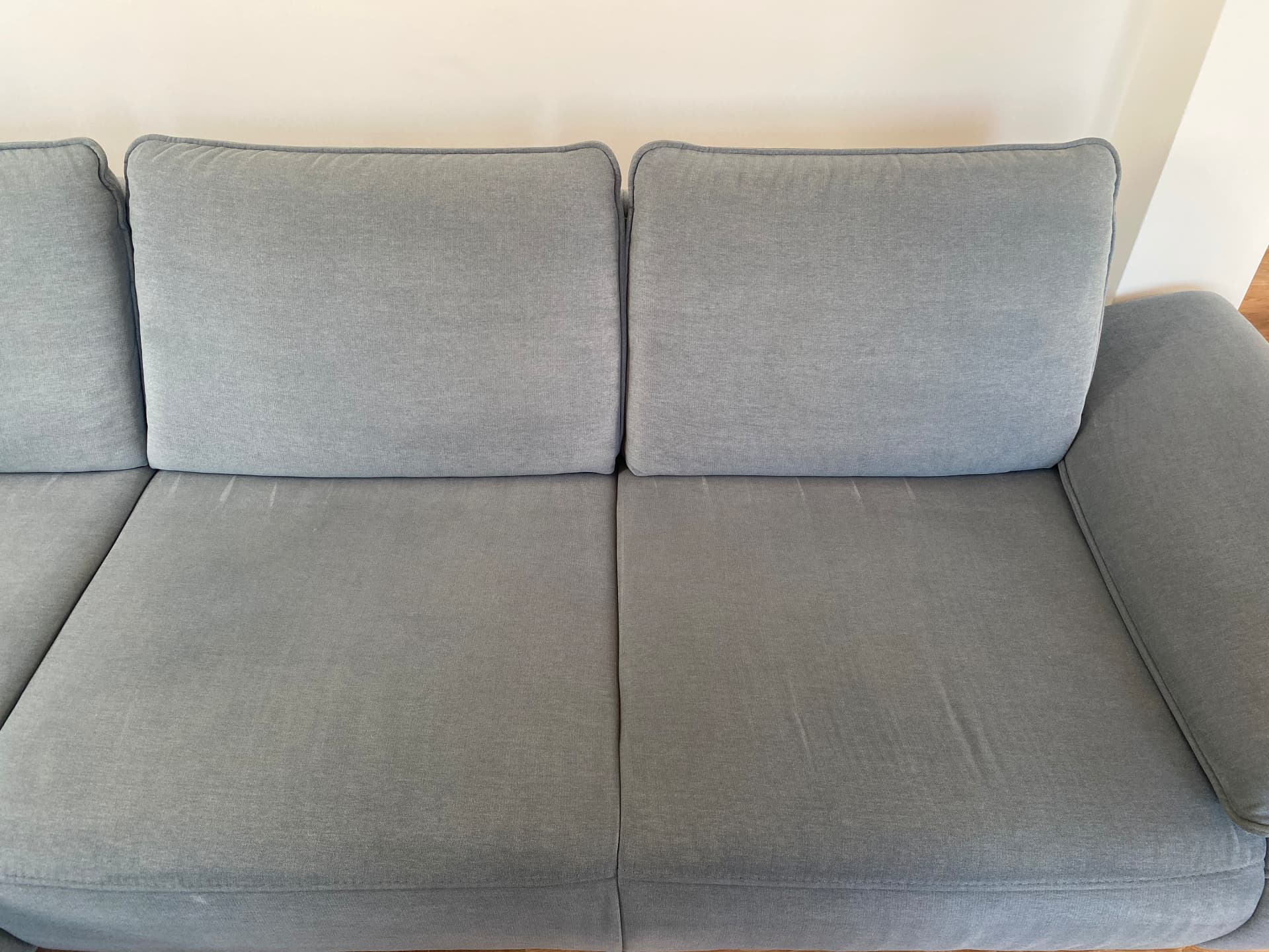 Stoffsofa grau · München nachher